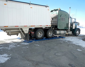 truck tractor being weighed on massload axle pad scale