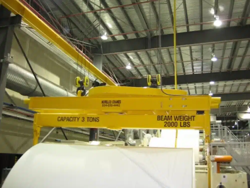 A closeup image of a digital hanging crane scale in a weighing facility.