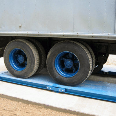 Portable truck axle pad scale used to weigh farm trucks transporting crops