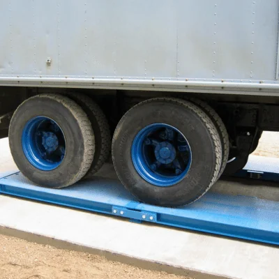 Portable truck axle pad scale used to weigh farm trucks transporting crops